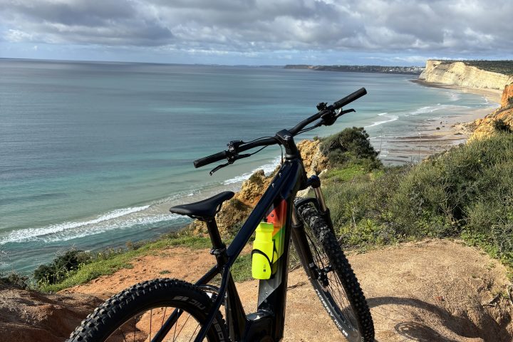 a bicycle is parked next to a body of water