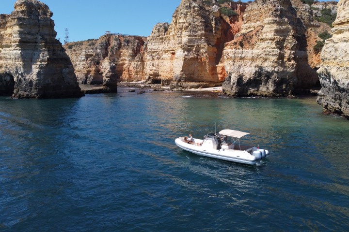 a small house surrounded by water
